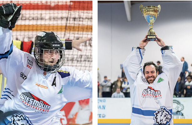 Feiernder Spieler / Spieler, der einen Pokal in die Höhe trägt